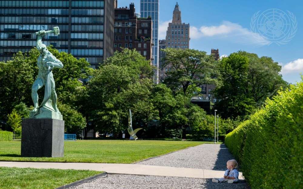 A young participant attends the unveiling of the Kusikawsay Monument, a gift from Colombia to the United Nations on July 11,2024 