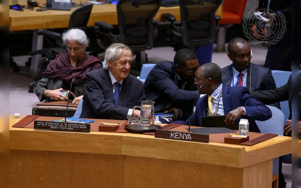 Nicholas Hayso, Special Representative of the Secretary-General and Head of the United Nations Mission in South Sudan, greets Michael Kapkiai Kiboino, Deputy Permanent Representative of Kenya to the United Nations, during the Security Council meeting on the situation in the Sudan and South Sudan 